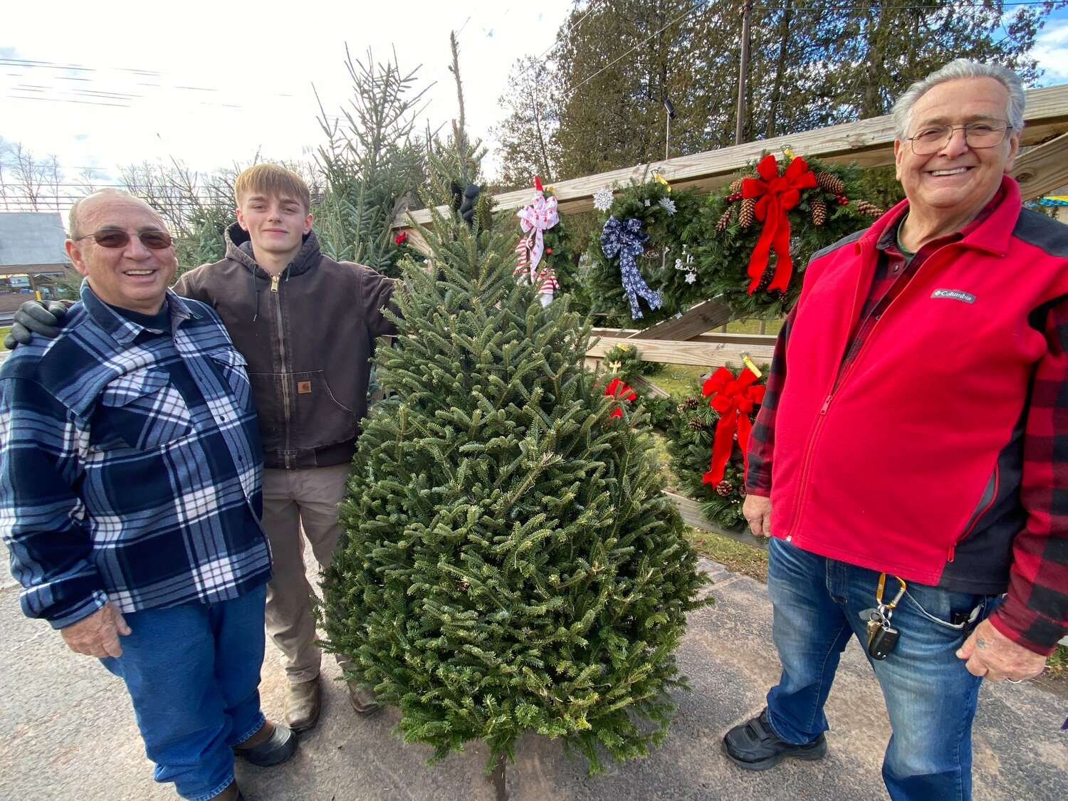 Patsy DiNardo, Phil Seiden and Jayden Hoffmeister manned the Walton Fire Department Christmas tree sale lot Sunday, Nov. 26.